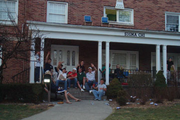 Sigma Chi, MSU, students on steps, cans on lawn