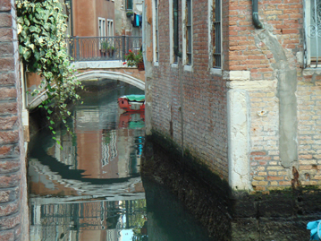 Venice, reflection of a bridge in the canal